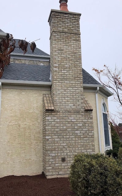 Rebuilt light brick chimney on stucco home in the Lehigh Valley, PA