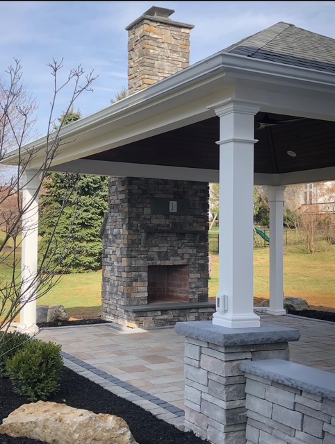 Outdoor stone fireplace with paver patio in Lehigh Valley